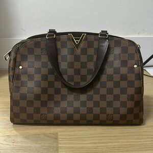 Louis Vuitton bag with top handle and long strap